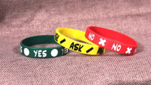 All three consent bands ("Yes/Ask/No") arranged on a cloth.