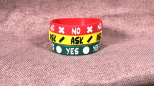 All three consent bands ("Yes/Ask/No") stacked on a cloth.