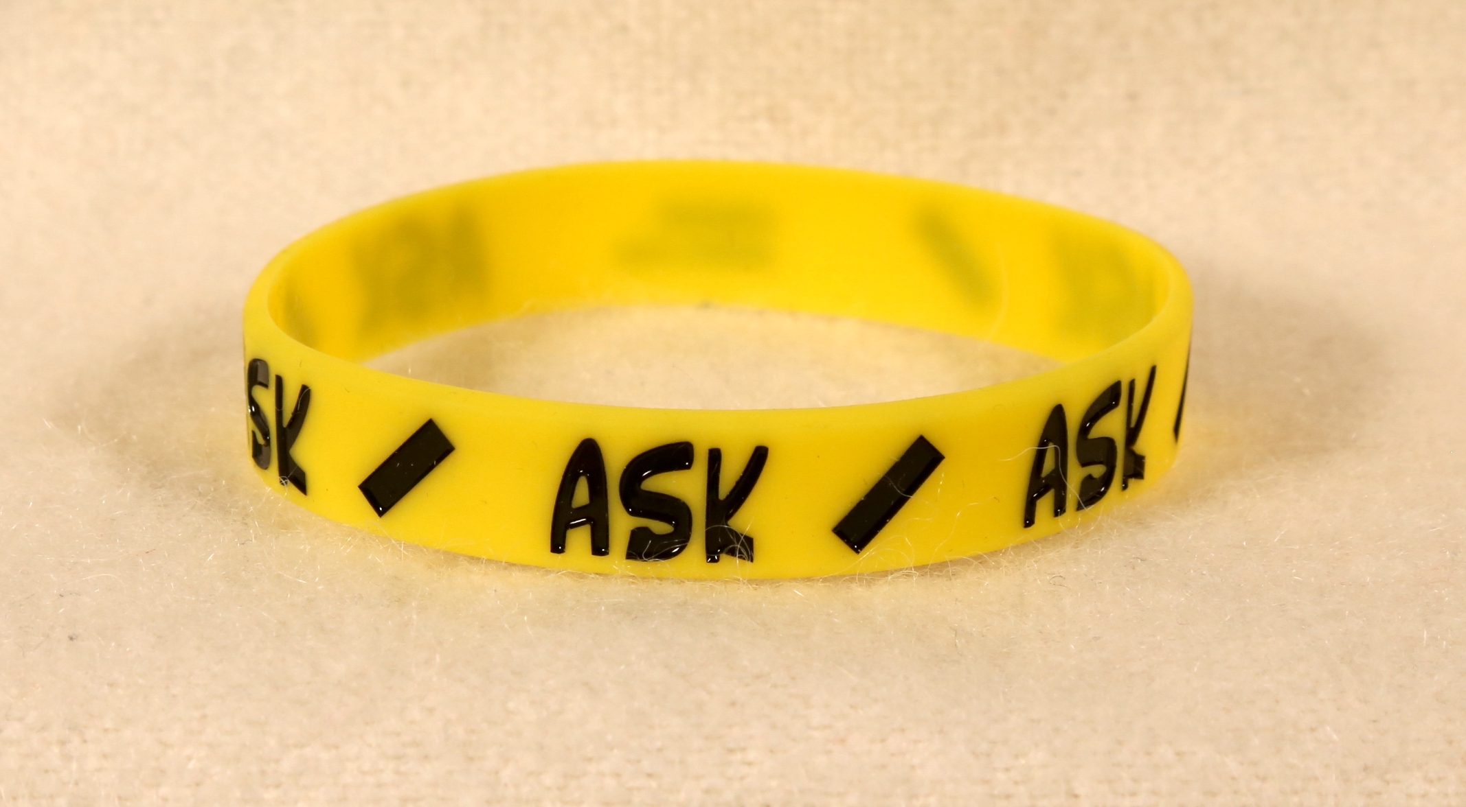 Photo of the yellow "Ask" band (2nd run).